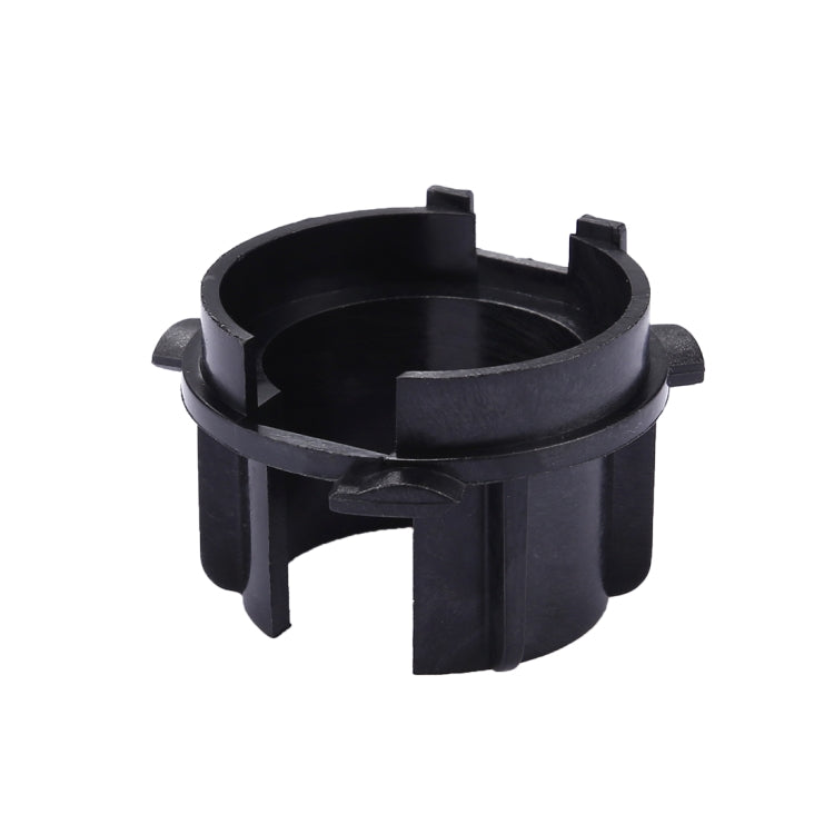 Black plastic headlight bulb base retainer adapter with open circular center