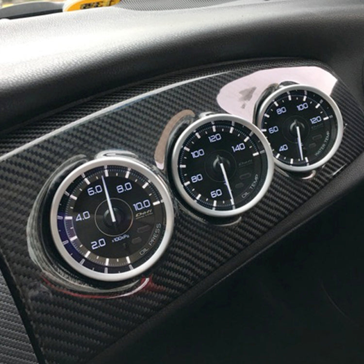 Three-gauge dashboard pod mount with carbon-fiber texture, installed in the car