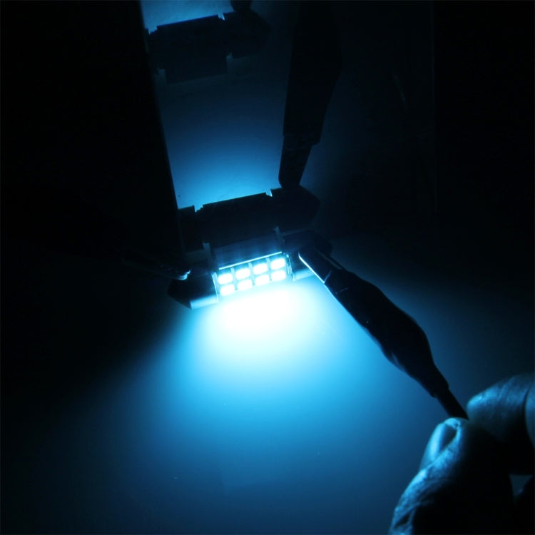 Blue-lit car dome reading light showing 39mm LED bulbs with green SMD square LEDs