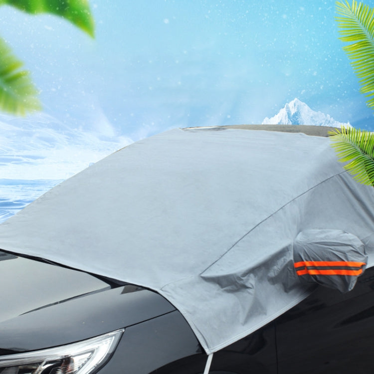Car windshield snow cover frost guard cloth, gray draped over front glass with orange stripe