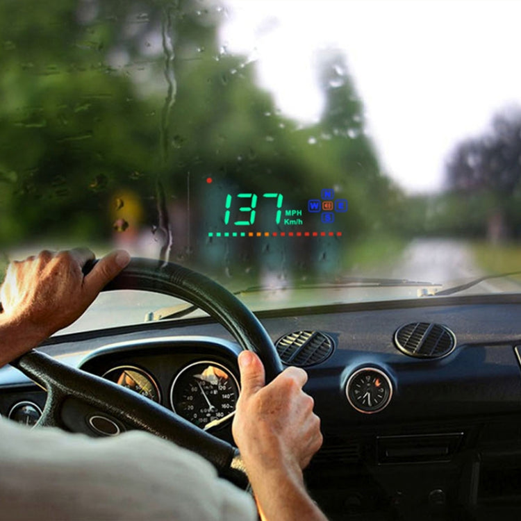 Windshield-projected GPS HUD showing green speed readout and mile/km icons