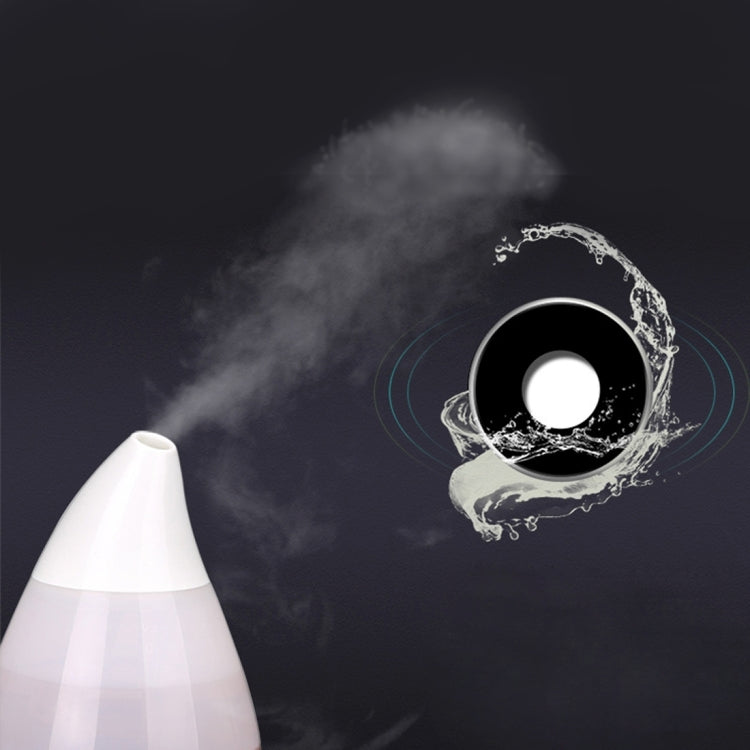 White ultrasonic humidifier releasing mist with circular spray indicator graphic