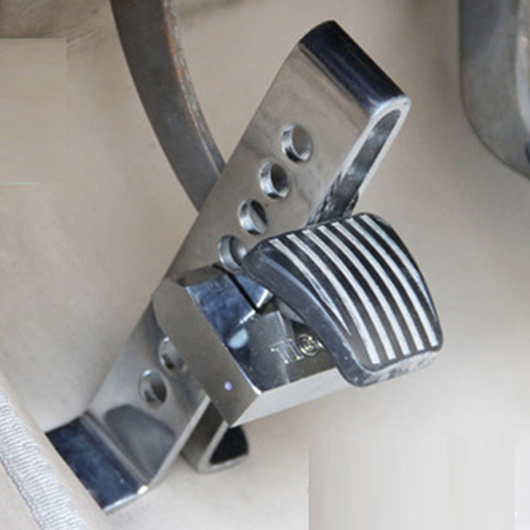 Ribbed clutch lock clamp with metal arm and key slot on pedal