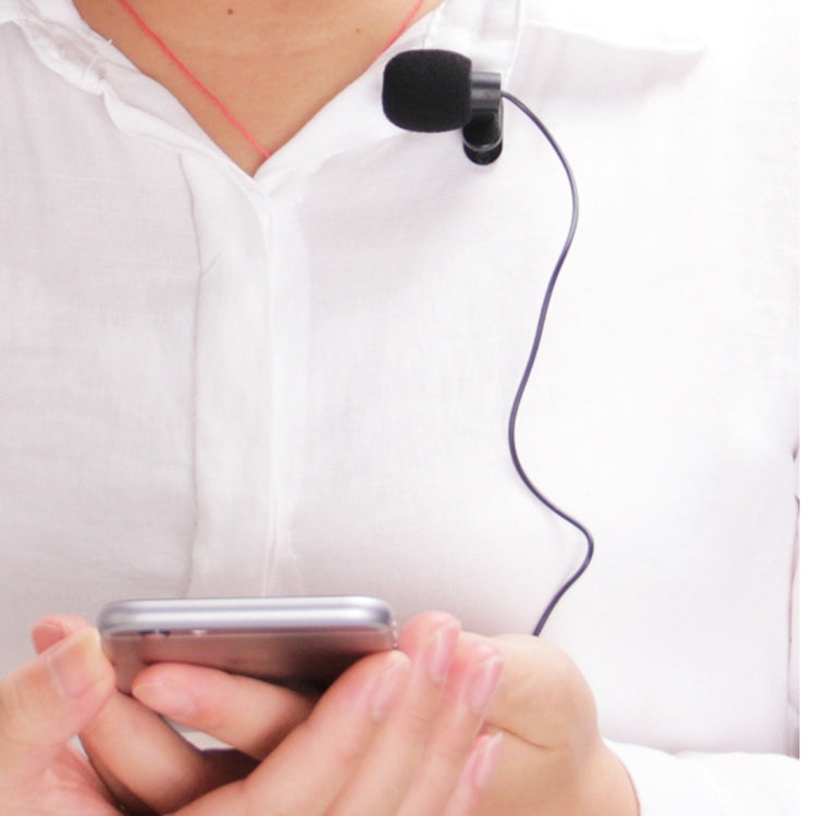 Clip-on car microphone worn on a shirt with wired cable