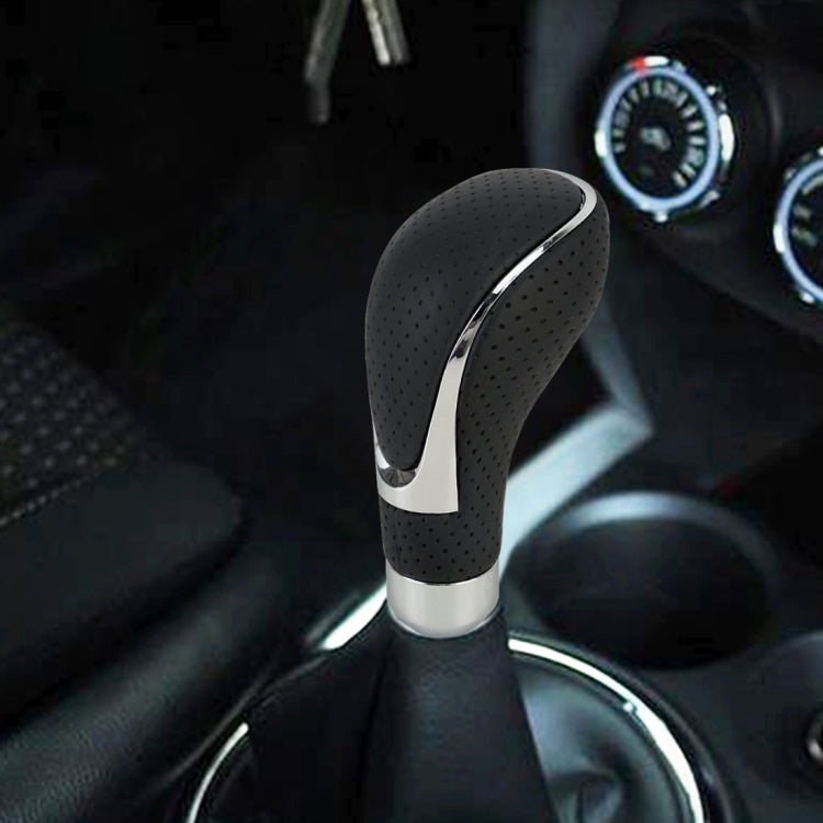 Black perforated PU leather gear shift knob with chrome trim and silver base