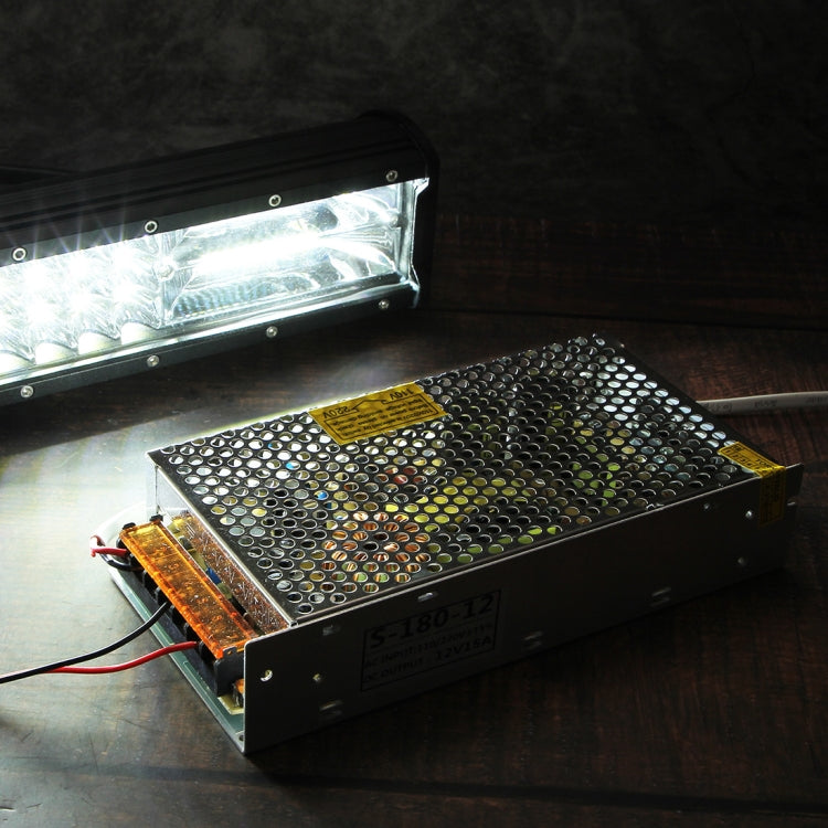 AC-DC step-down power supply module with vented metal chassis and warning label