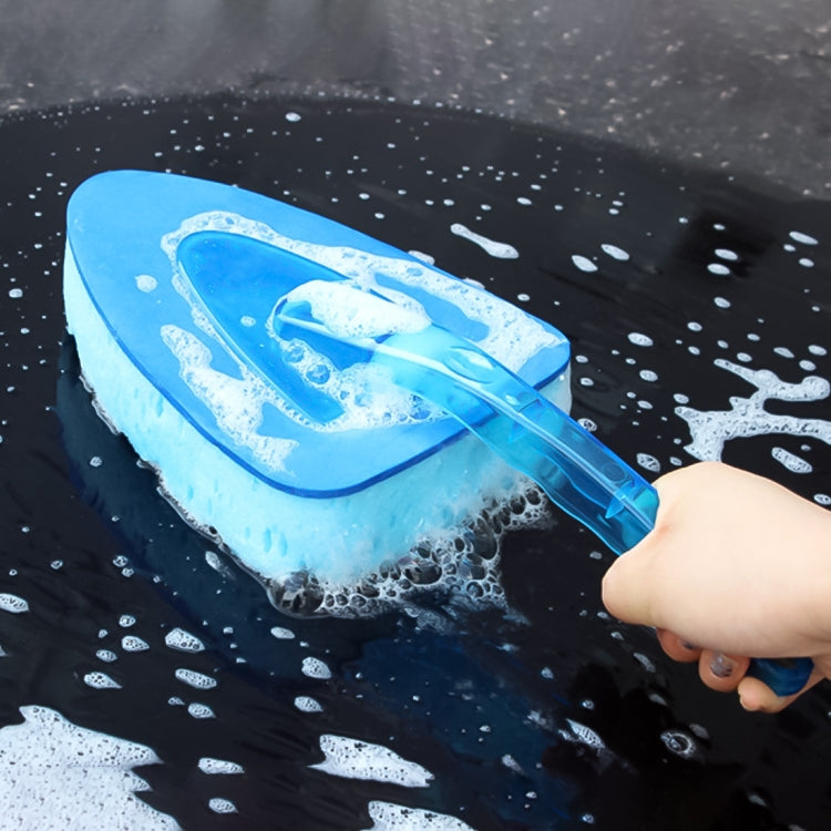 Blue car washing sponge with clear handle, suds on dark car paint