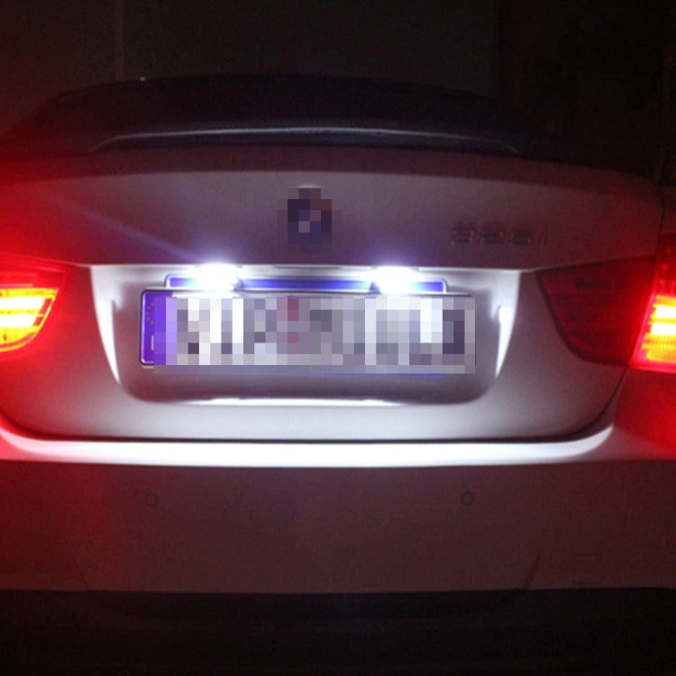 LED license plate lights glowing white on a rear vehicle license plate