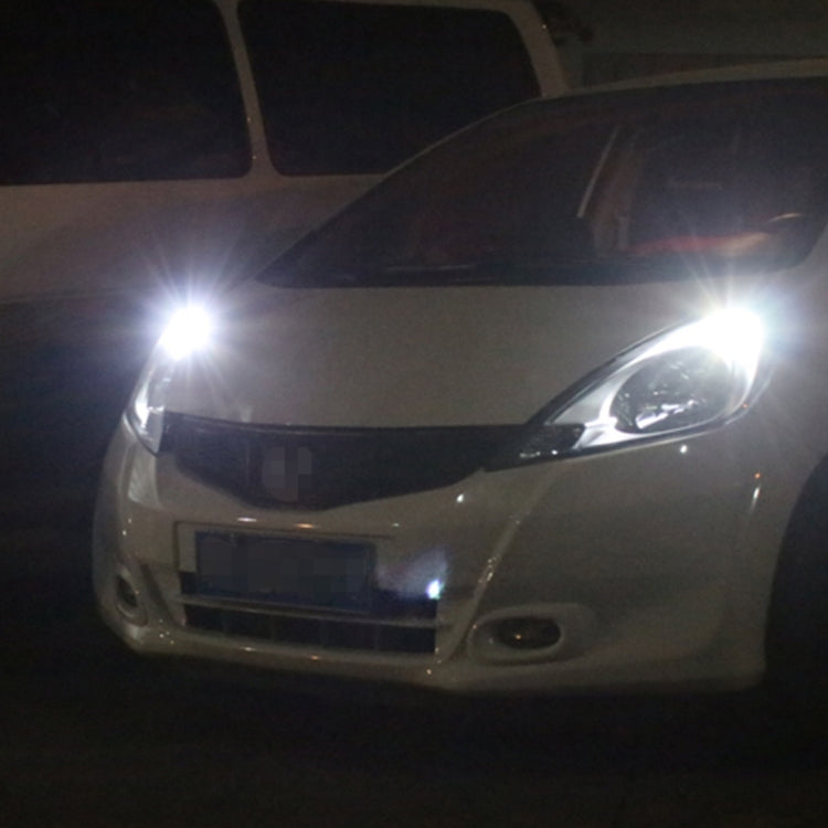 Car front with LED clearance lights on, bright white bulbs near the bumper