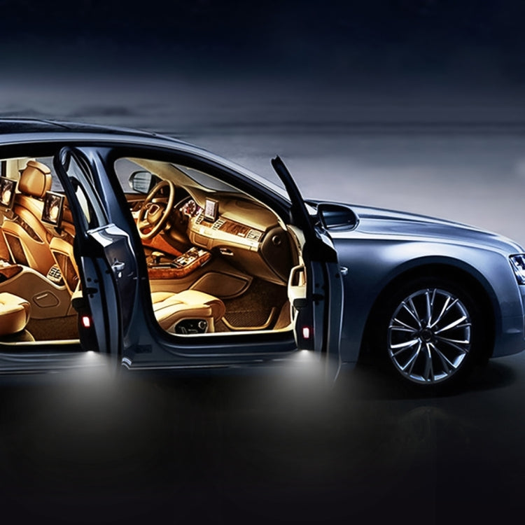 LED car door lights installed on open door, illuminating the vehicle doorway area