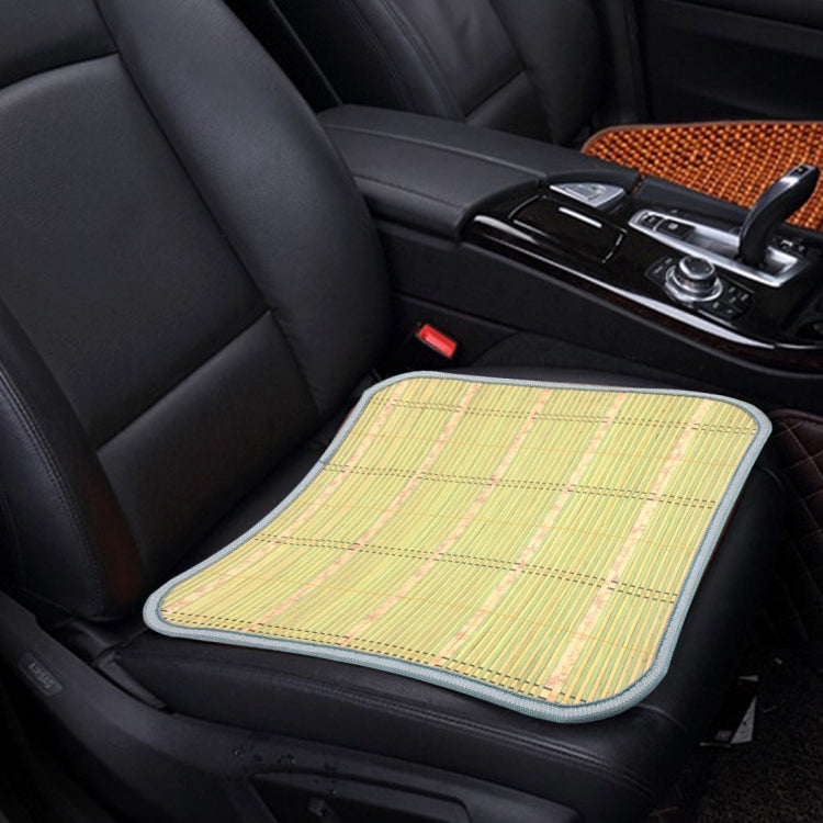 Bamboo seat cushion pad mat in light green on car seat, rounded edges with blue trim