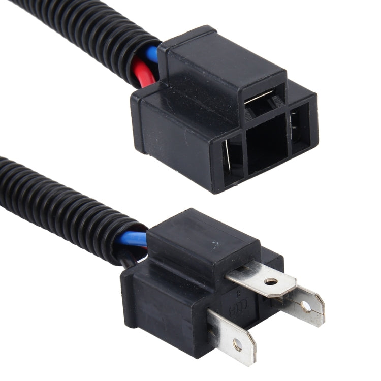 H4 conversion cable with black connectors and metal blade terminals, close-up