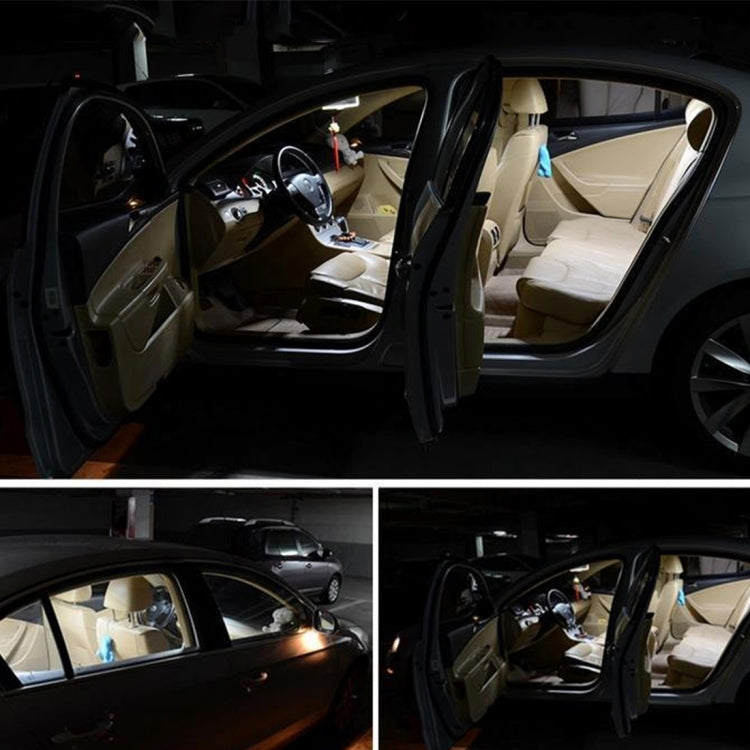 Car interior with door open and LED dome/reading lights switched on.