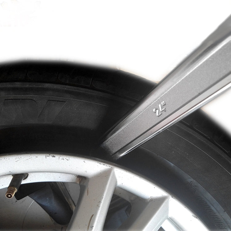 Stainless steel tire crowbar positioned at the wheel rim between tire and rim