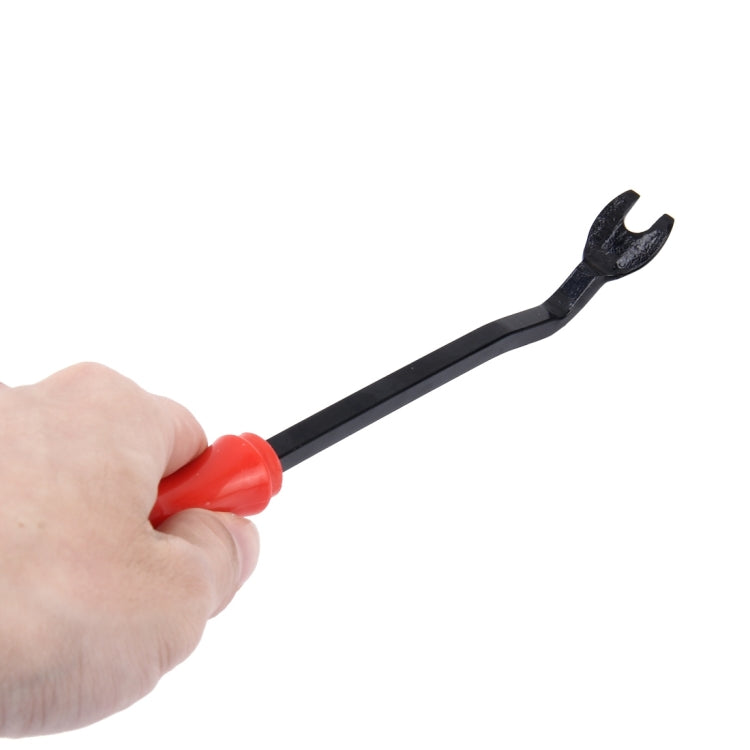 Trim panel clip remover tool held in hand; red handle and black pry fork