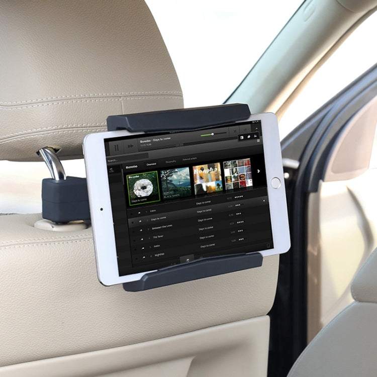 Rear seat tablet holder gripping a tablet with a secure clamp mount