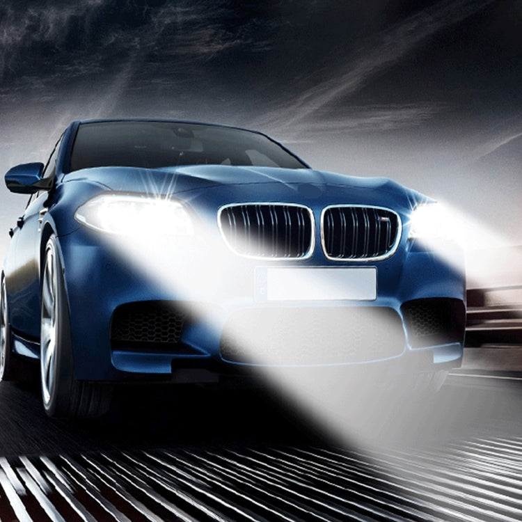 Car with bright HID xenon headlights illuminating the road