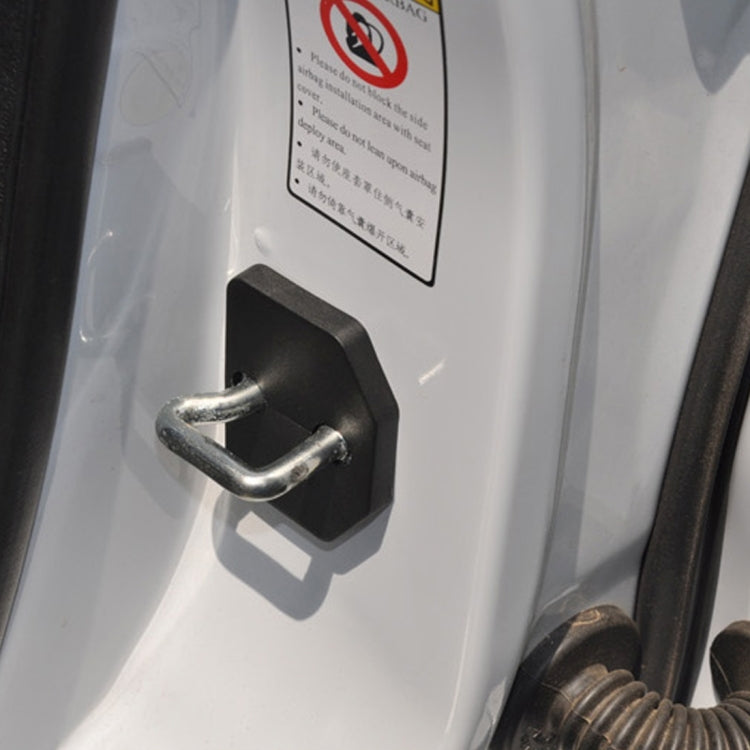 Black lock cover mounted on car door lock latch with metal hook.
