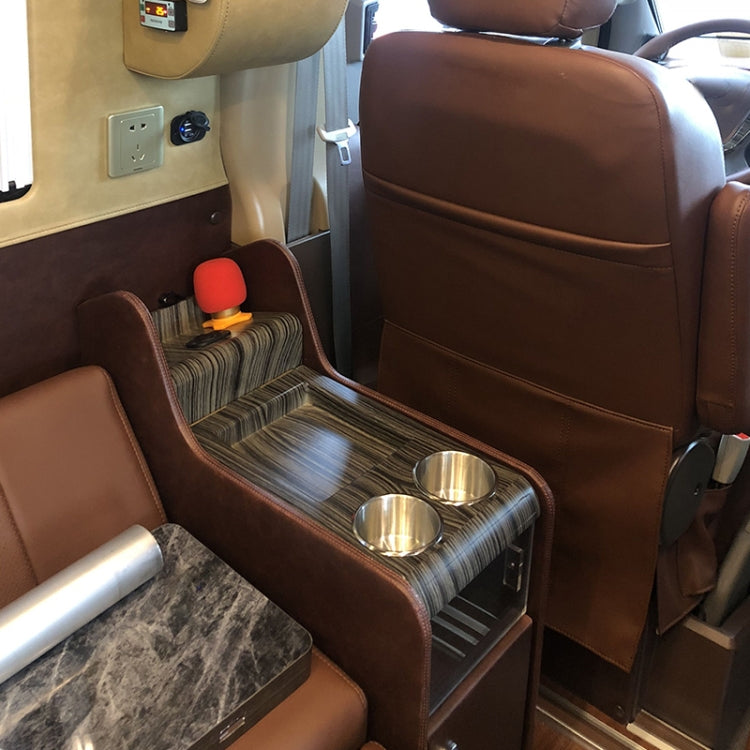 Stainless steel cup holders built into an RV/vehicle seat side table
