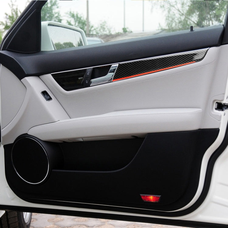 Carbon fiber-look inner door panel decal strip with red accent line, installed