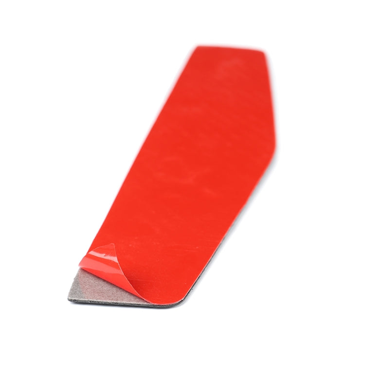 Adhesive-backed carbon-fiber-look sticker with red backing sheet