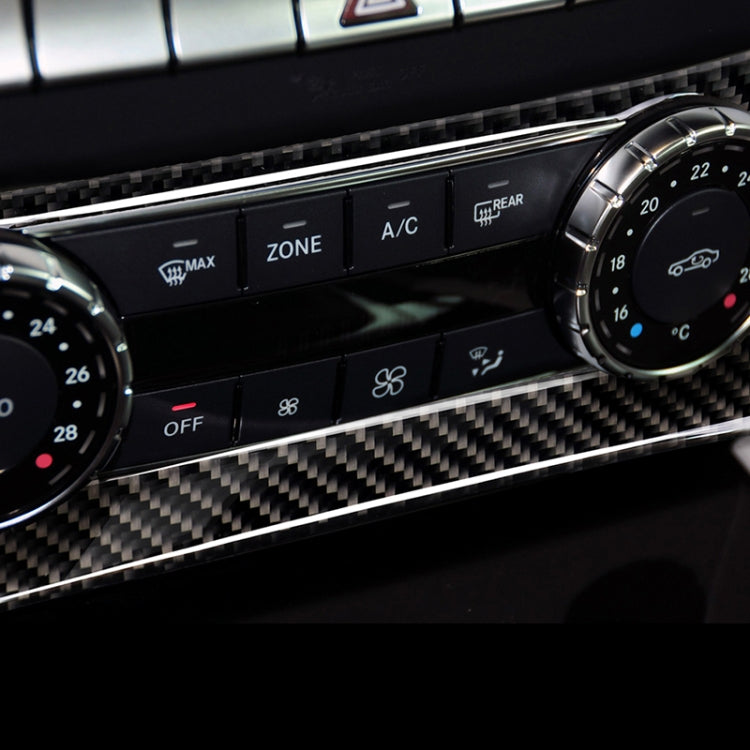 Carbon fiber air conditioning control panel sticker strip with oval cutout on dashboard