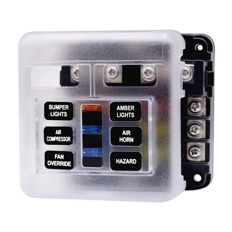 Clear-cover accessory fuse panel with labeled circuit positions and mounting screws