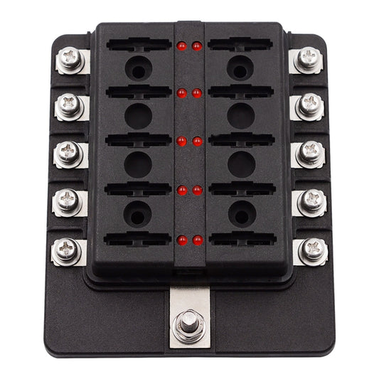Front view of black fuse box with screw terminals, empty slots, and red LED indicators