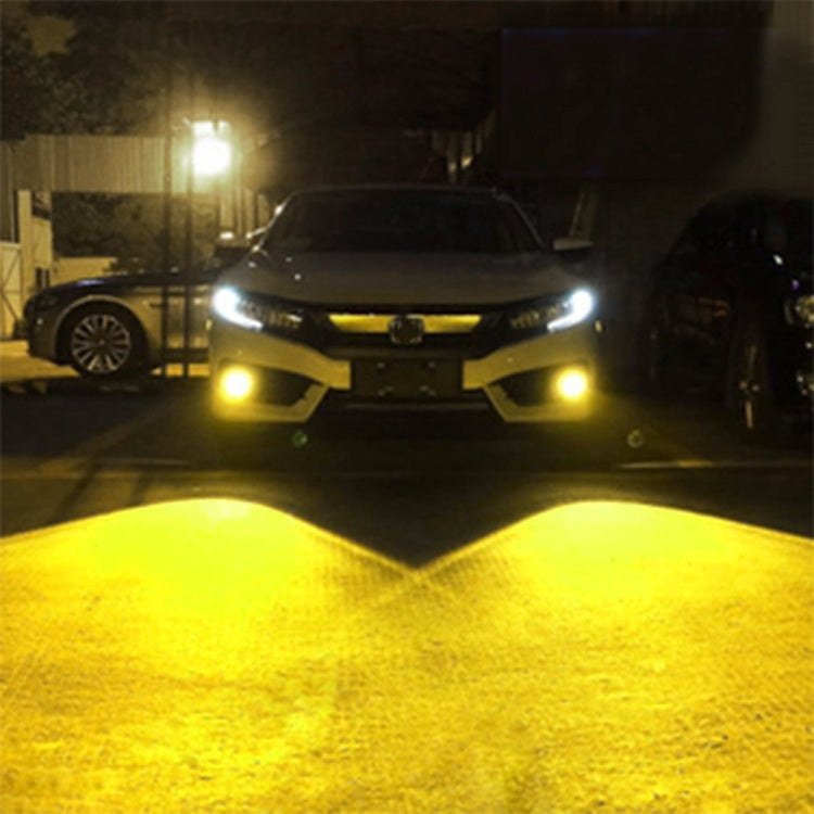 Yellow LED fog lights glowing on a car front with bright low-beam illumination