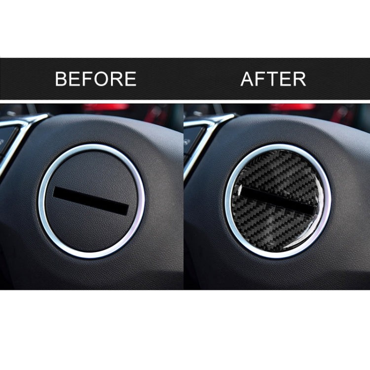 Before-and-after steering wheel center: plain logo replaced by carbon-fiber bar sticker