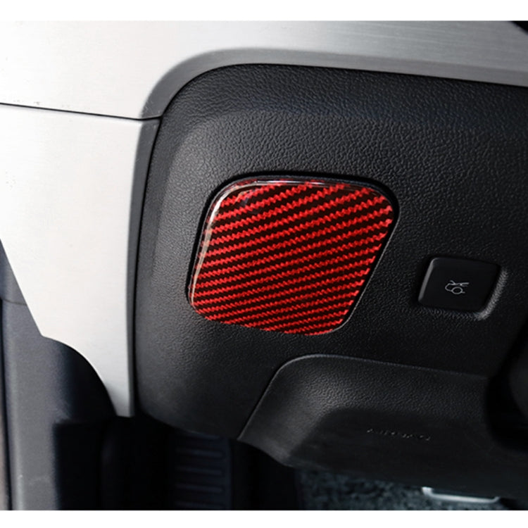 Car seat storage box sticker with red carbon-fiber pattern on dark console