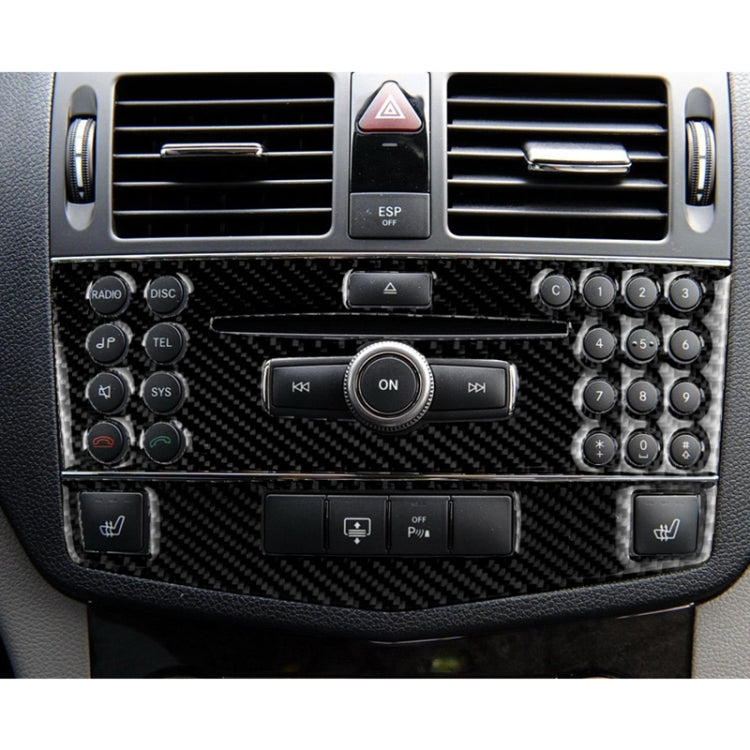 Black carbon-fiber center console panel trim with audio and phone controls