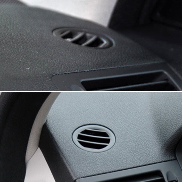 Circular dashboard air vent outlet with silver ring and black adjustable slats
