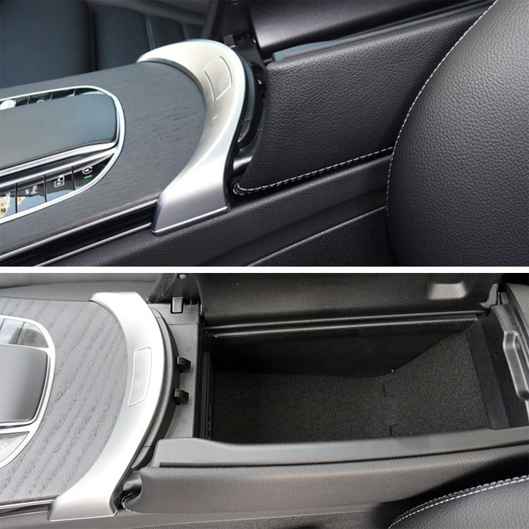 Installed silver armrest switch cover on dark interior panel with surrounding trim