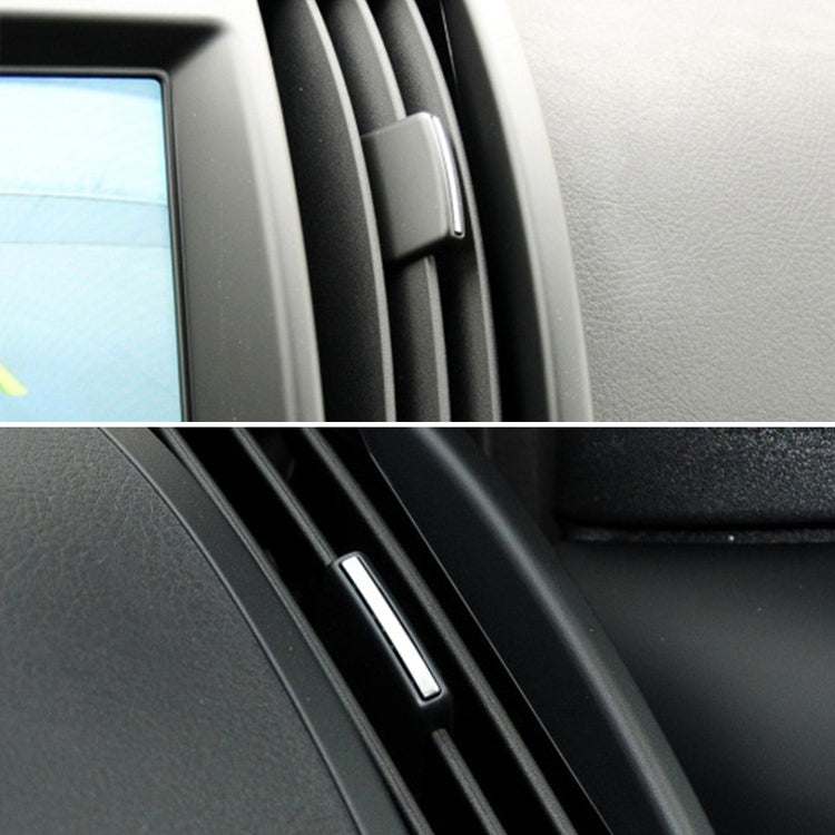 Black switch paddle installed in car air vent slot