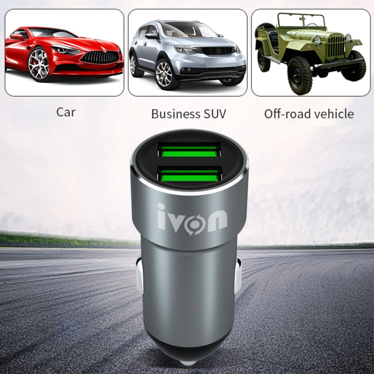 Gray dual USB car charger with green-lit ports for vehicle use.