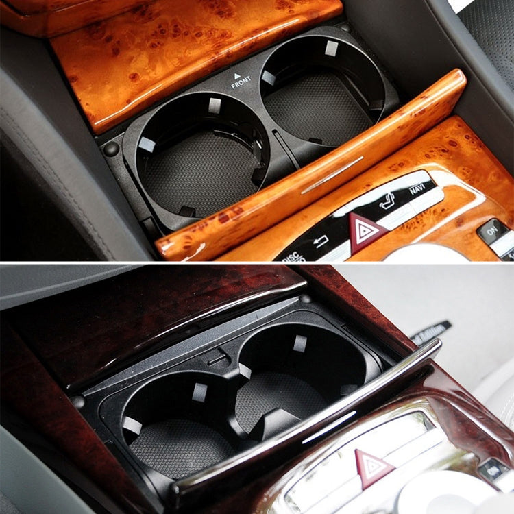 Black dual cup holder insert in car console showing two circular cup openings.