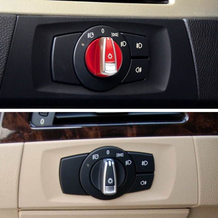Headlight switch knob cover trim installed on dash, red center with silver sun icon lever