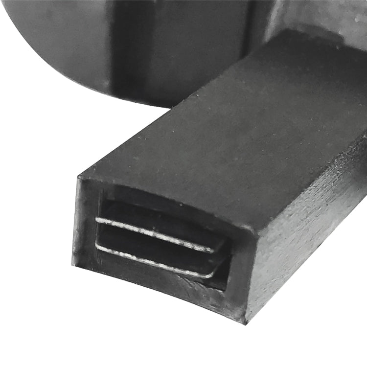 Close-up of right car seat release handle tab, black plastic rectangular slot