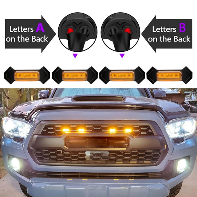 Amber LED lights installed on front grille area of a pickup truck