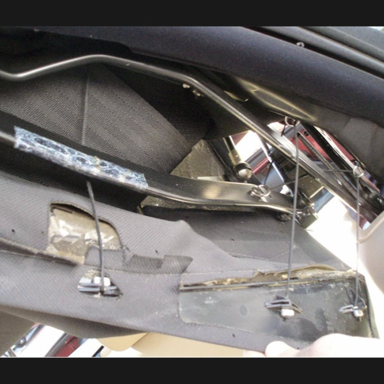 Convertible top C-pillar interior view with metal bracket mounts and fasteners