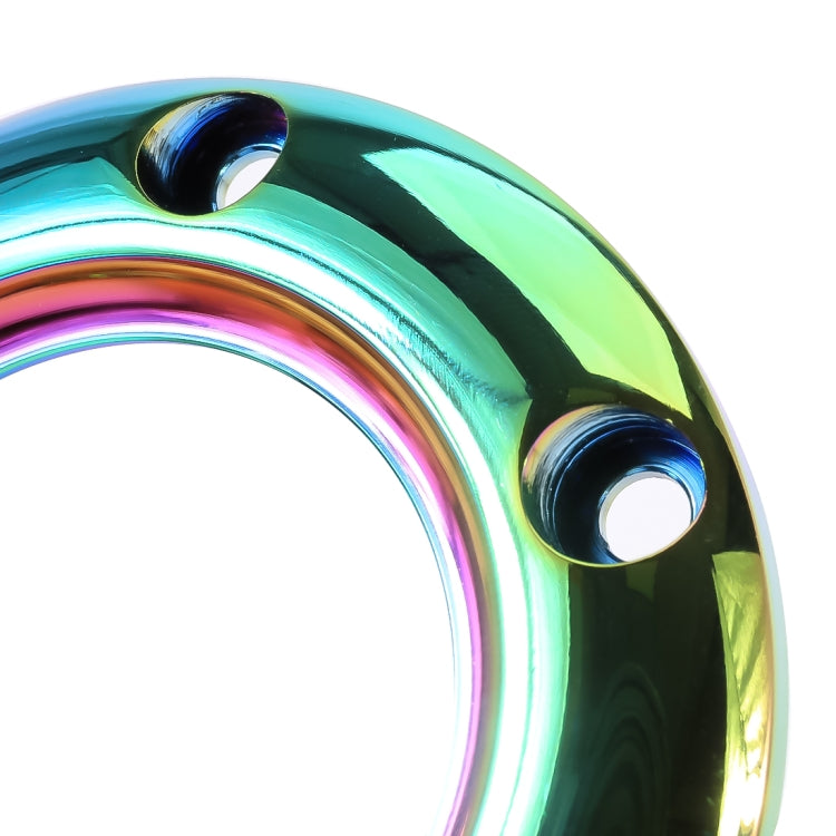 Steering wheel horn button cover close-up, iridescent rainbow finish with two mounting holes