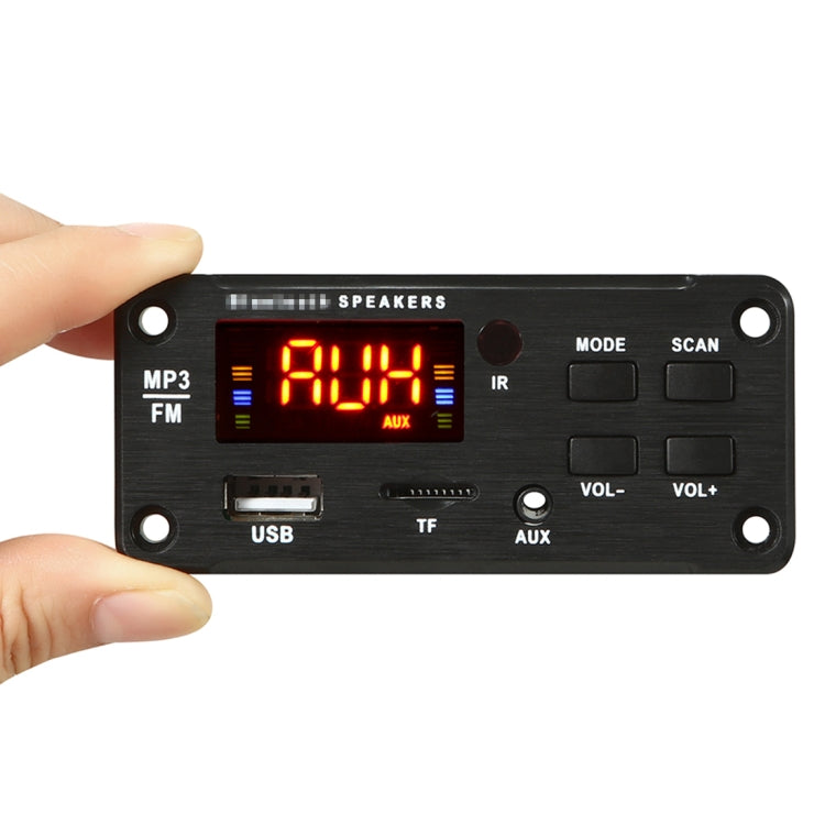 Car audio MP3 player with red LED display, USB and AUX ports, hand pressing controls