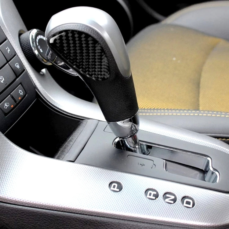Black carbon-fiber gear shift panel sticker on center console around shifter