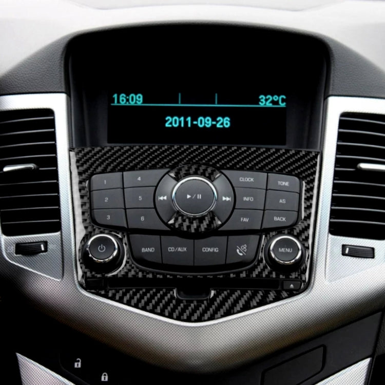 Installed carbon fiber CD panel sticker around audio controls and display