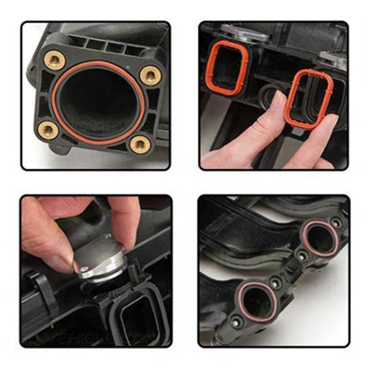 Swirl flap gasket installation showing orange sealing ring on black intake housing