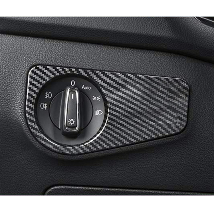Installed carbon fiber headlight switch trim over dashboard dial, black woven finish