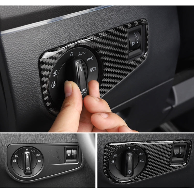 Carbon fiber headlight switch panel trim sticker installed on dashboard, showing dial and button