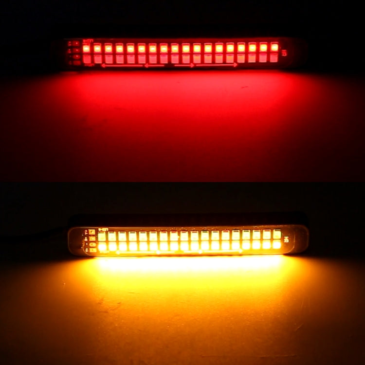 Red and amber glowing LED light bar showing bright segmented brake and turn signal