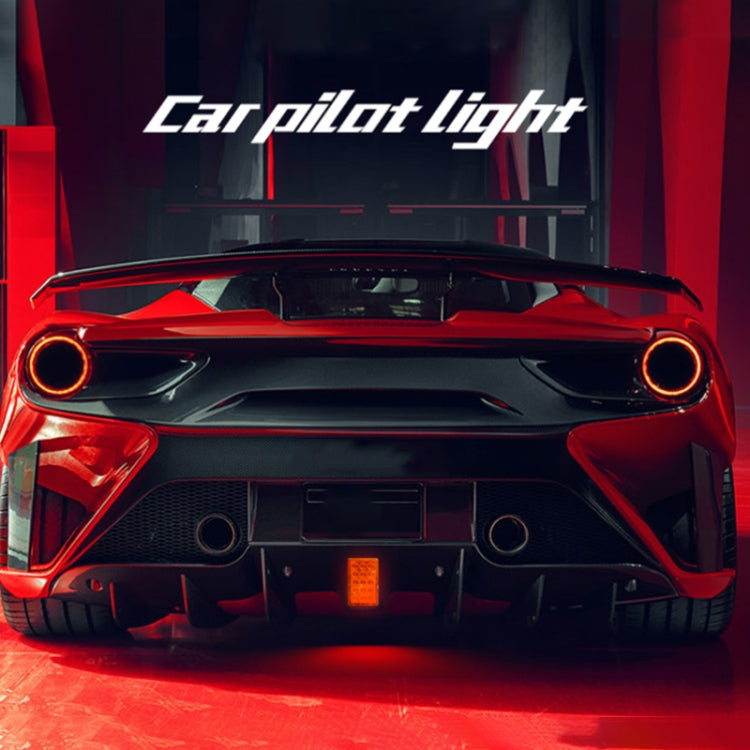 Square LED tail light with red glow and circular accents on rear car